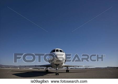 Picture - Stationary private jet on airfield tarmac. Fotosearch