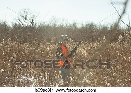 Teenage boy hunting with shotgun in Petersburg State Game Area, Michigan, USA View Large Photo Image Stock Photo - Teenage boy hunting with shotgun in Petersburg State Game Area, Michigan, USA. Fotosearch