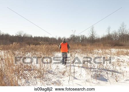 Stock Image - Teenage boy out hunting in Petersburg State Game Area, Michigan, USA. Fotosearch