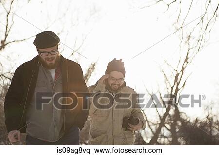 Stock Photography - Two young men out strolling in winter. Fotosearch