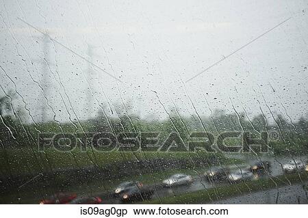 View through window of highway and traffic on a rainy day View Large Photo Image Stock Photography - View through window of highway and traffic on a rainy day. Fotosearch