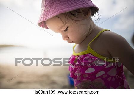 Baby playing on sandy beach View Large Photo Image Stock Photo - Baby playing on sandy beach. Fotosearch