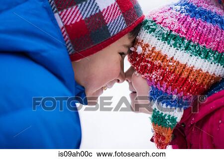 Brother and sister face to face in snow View Large Photo Image Stock Image - Brother and sister face to face in snow. Fotosearch