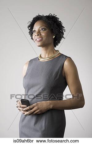 Businesswoman holding smartphone View Large Photo Image Stock Photography - Businesswoman holding smartphone. Fotosearch