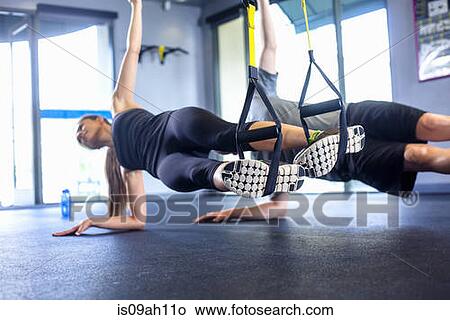 Couple doing side plank exercise View Large Photo Image Picture - Couple doing side plank exercise. Fotosearch