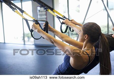 Couple working out in gym View Large Photo Image Stock Image - Couple working out in gym. Fotosearch