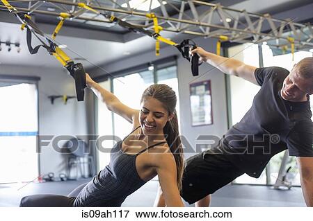 Couple working out in gym View Large Photo Image Stock Photo - Couple working out in gym. Fotosearch