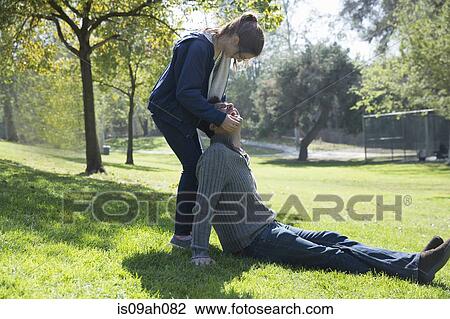Father and daughter playing on grass View Large Photo Image Stock Image - Father and daughter playing on grass. Fotosearch