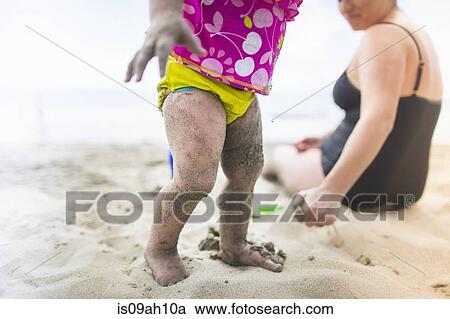 Stock Image - Mother and daughter by seaside. Fotosearch