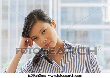Picture - Portrait of bored female office worker. Fotosearch