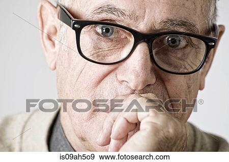 Portrait of senior man, hand on mouth View Large Photo Image Stock Photo - Portrait of senior man, hand on mouth. Fotosearch