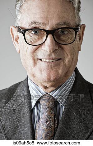 Stock Photo - Portrait of senior man, wearing suit and tie. Fotosearch