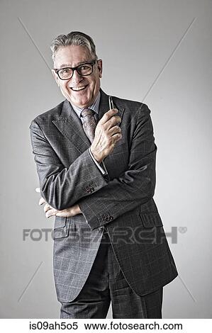 Stock Photography - Portrait of senior man, wearing suit. Fotosearch