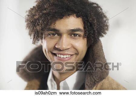 Picture - Portrait of young man smiling. Fotosearch