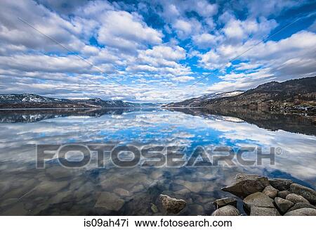 Sky reflected in Okanagan Lake, Naramata, British Columbia, Canada View Large Photo Image Stock Image - Sky reflected in Okanagan Lake, Naramata, British Columbia, Canada. Fotosearch