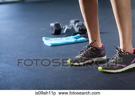 Sports shoes, weights, towel View Large Photo Image Stock Photography - Sports shoes, weights, towel. Fotosearch