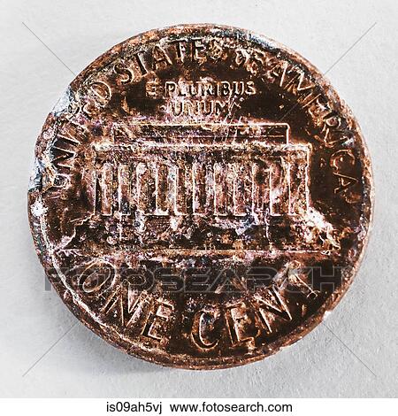 Stock Image - Still life of a scratched and chipped one cent coin. Fotosearch
