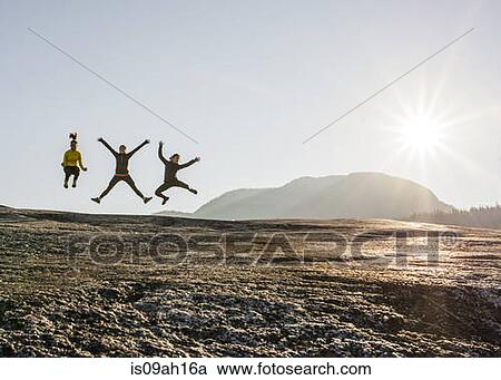 Three young female hikers jumping mid air on rock, Squamish, British Columbia, Canada View Large Photo Image Stock Image - Three young female hikers jumping mid air on rock, Squamish, British Columbia, Canada. Fotosearch
