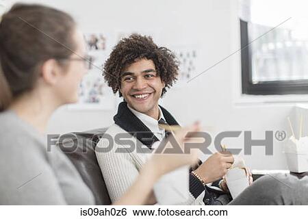 Two colleagues eating lunch View Large Photo Image Stock Photograph - Two colleagues eating lunch. Fotosearch