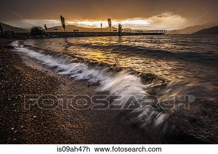 Stock Image - Waves on shore of Okanagan Lake, Naramata, British Columbia, Canada. Fotosearch