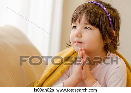 Young girl sitting on sofa daydreaming View Large Photo Image Stock Photograph - Young girl sitting on sofa daydreaming. Fotosearch
