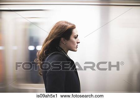 Young woman commuting on subway View Large Photo Image Stock Image - Young woman commuting on subway. Fotosearch