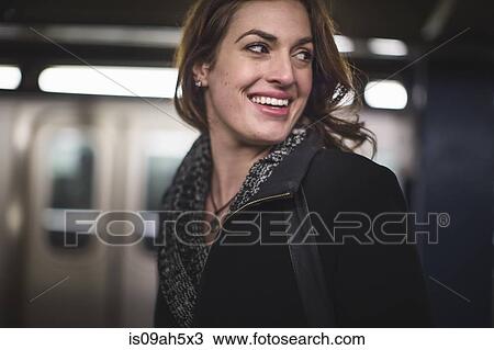 Young woman in subway station View Large Photo Image Stock Image - Young woman in subway station. Fotosearch