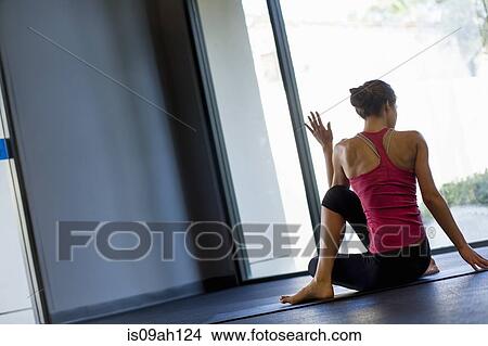 Picture - Young woman in yoga pose. Fotosearch