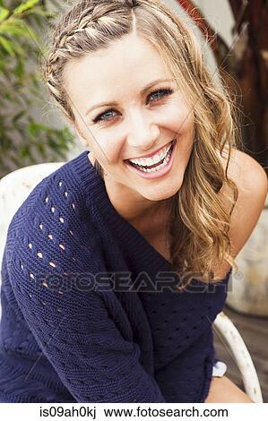 Young woman wearing purple sweater laughing View Large Photo Image Stock Image - Young woman wearing purple sweater laughing. Fotosearch
