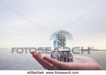 Young woman's hand holding landmark snowglobe, New York, USA View Large Photo Image Stock Image - Young woman's hand holding landmark snowglobe, New York, USA. Fotosearch