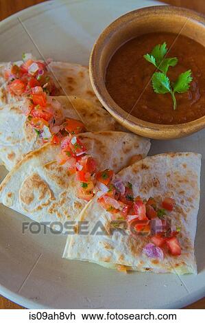 Stock Image - Aruban food, flatbreads with salsa and dipping sauce. Fotosearch