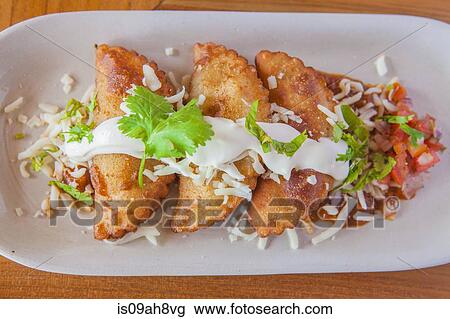 Aruban food, pastries with sauce and garnish on plate View Large Photo Image Stock Image - Aruban food, pastries with sauce and garnish on plate. Fotosearch