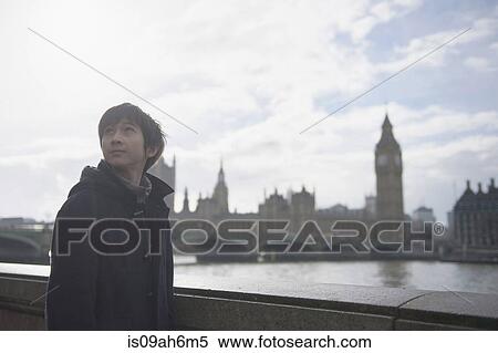 Boy by River Thames, Palace of Westminster in background, London View Large Photo Image Stock Photography - Boy by River Thames, Palace of Westminster in background, London. Fotosearch