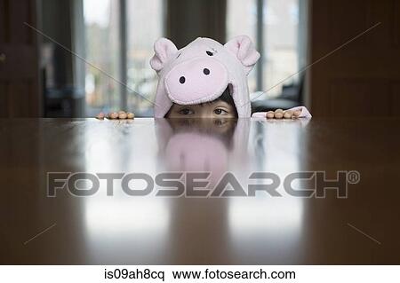 Boy in costume peering over table View Large Photo Image Stock Photography - Boy in costume peering over table. Fotosearch