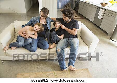 Family with two boys on sofa View Large Photo Image Stock Image - Family with two boys on sofa. Fotosearch