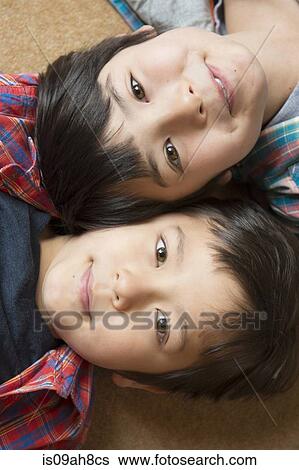 Stock Photograph - Portrait of happy brothers. Fotosearch