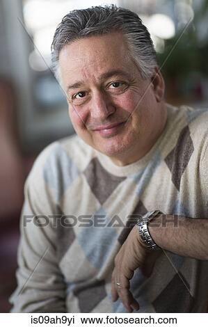Portrait of mature man at home View Large Photo Image Stock Image - Portrait of mature man at home. Fotosearch
