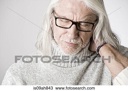 Portrait of mature man, eyes closed, hand on head View Large Photo Image Stock Image - Portrait of mature man, eyes closed, hand on head. Fotosearch