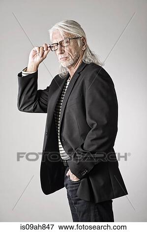 Portrait of mature man, hand in pocket View Large Photo Image Stock Photo - Portrait of mature man, hand in pocket. Fotosearch