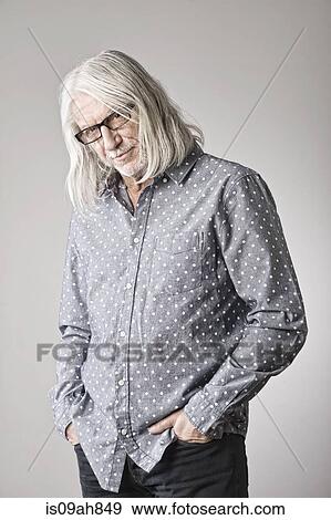 Portrait of mature man, hand in pocket View Large Photo Image Stock Photo - Portrait of mature man, hand in pocket. Fotosearch