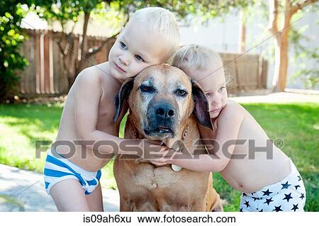 Portrait of old dog and toddler twins View Large Photo Image Stock Photograph - Portrait of old dog and toddler twins. Fotosearch