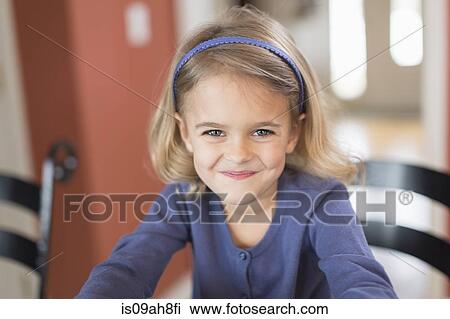 Stock Image - Portrait of smiling cute young girl. Fotosearch