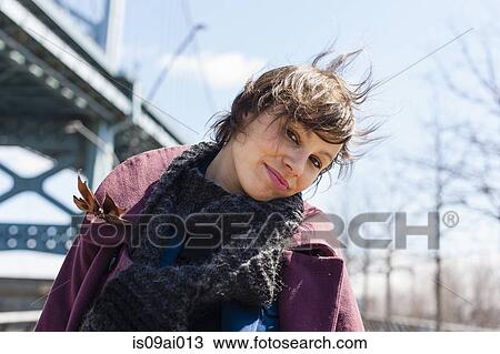 Portrait of young woman leaning over View Large Photo Image Stock Image - Portrait of young woman leaning over. Fotosearch