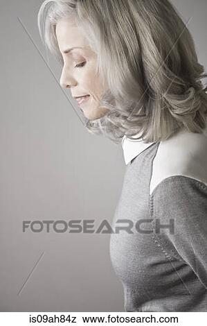 Side view of mature woman View Large Photo Image Stock Photo - Side view of mature woman. Fotosearch