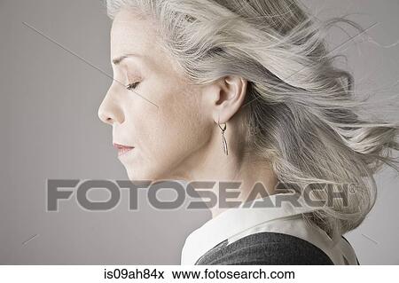 Side view of mature woman with eyes closed View Large Photo Image Stock Photo - Side view of mature woman with eyes closed. Fotosearch