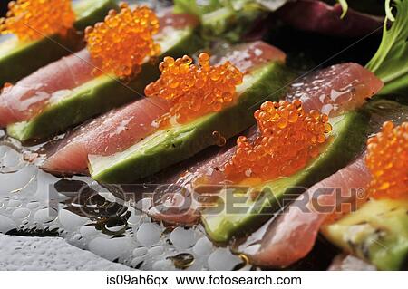 Still life of sliced avocado with fish and fish roe View Large Photo Image Stock Photo - Still life of sliced avocado with fish and fish roe. Fotosearch