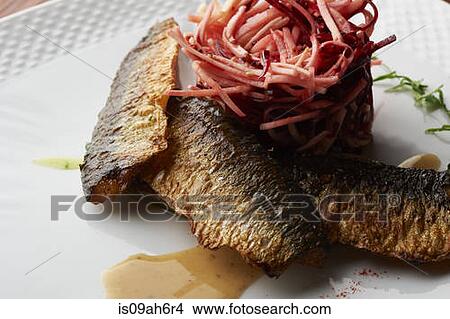 Still life of smoked fish with a stack of grated vegetable View Large Photo Image Picture - Still life of smoked fish with a stack of grated vegetable. Fotosearch
