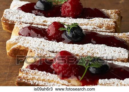 Still life of three cakes with fruit and icing sugar topping View Large Photo Image Stock Image - Still life of three cakes with fruit and icing sugar topping. Fotosearch