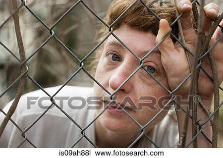 Woman behind fence View Large Photo Image Stock Image - Woman behind fence. Fotosearch