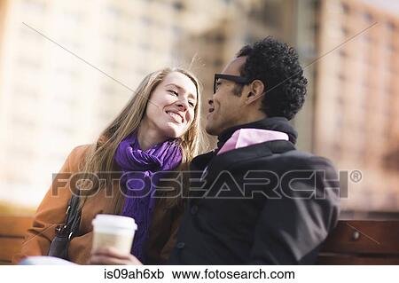 Young couple face to face on park bench, New York, USA View Large Photo Image Stock Image - Young couple face to face on park bench, New York, USA. Fotosearch